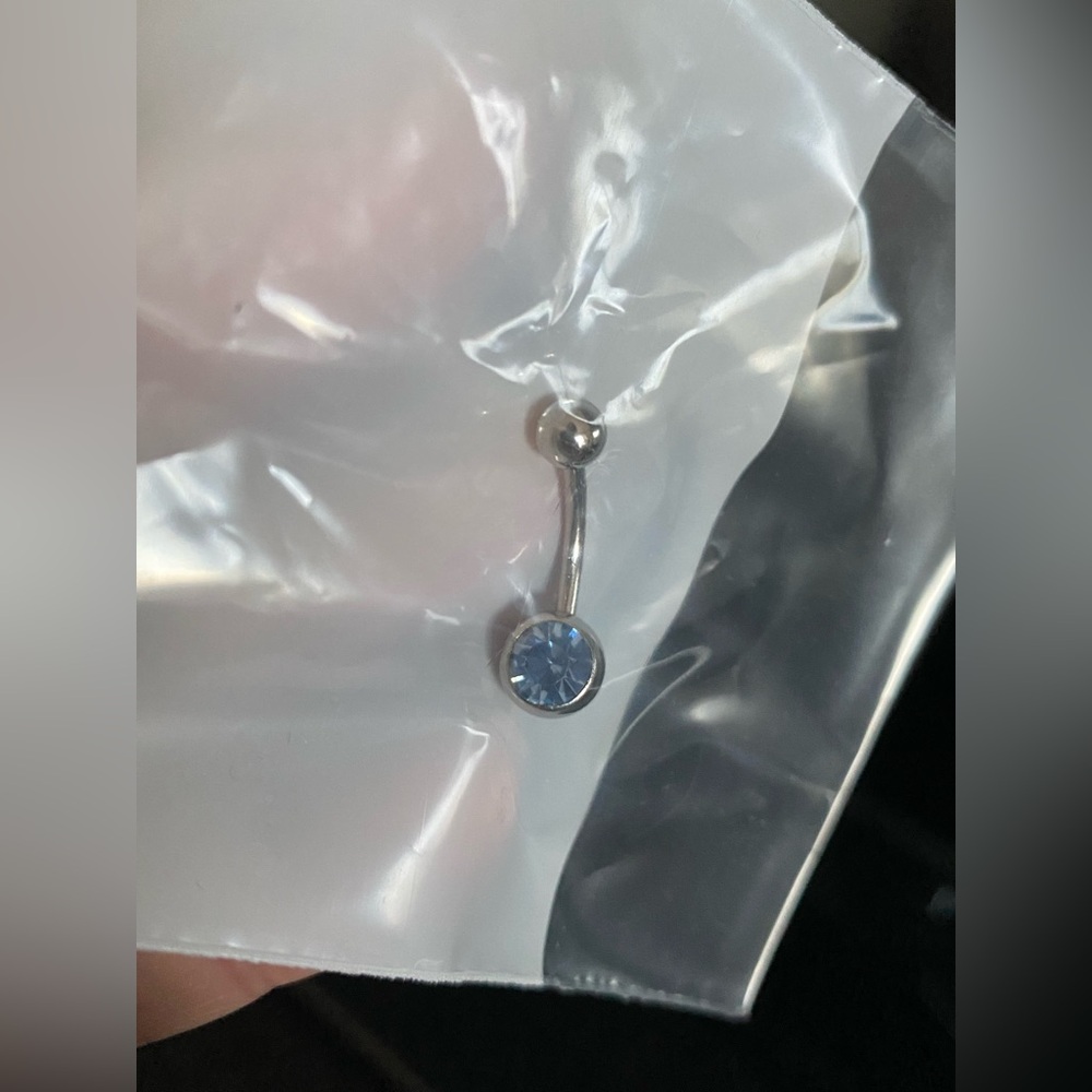 Light blue bellybutton ring